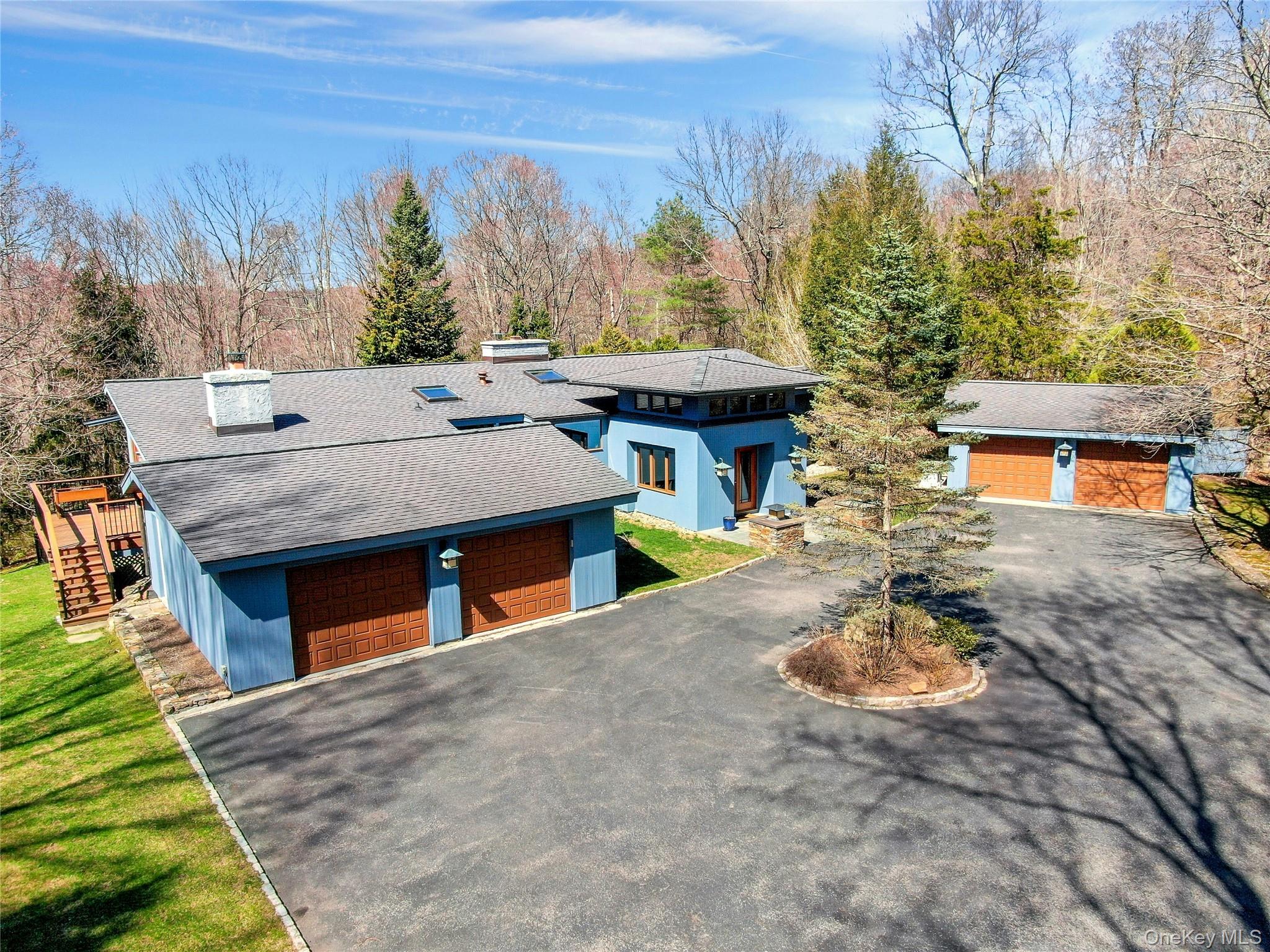 120 Kitchawan Road Pound Ridge, NY 10576 - Photo 2 of 40 a view of a patio with table and chairs with wooden floor and fence