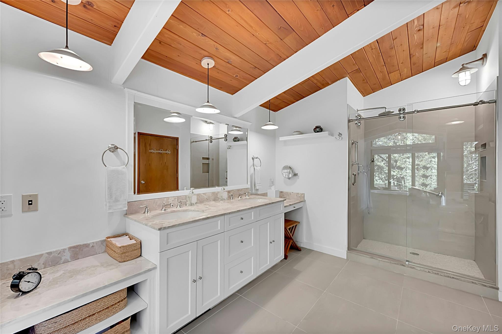 120 Kitchawan Road Pound Ridge, NY 10576 - Photo 22 of 40 a bathroom with a granite countertop sink a mirror and shower