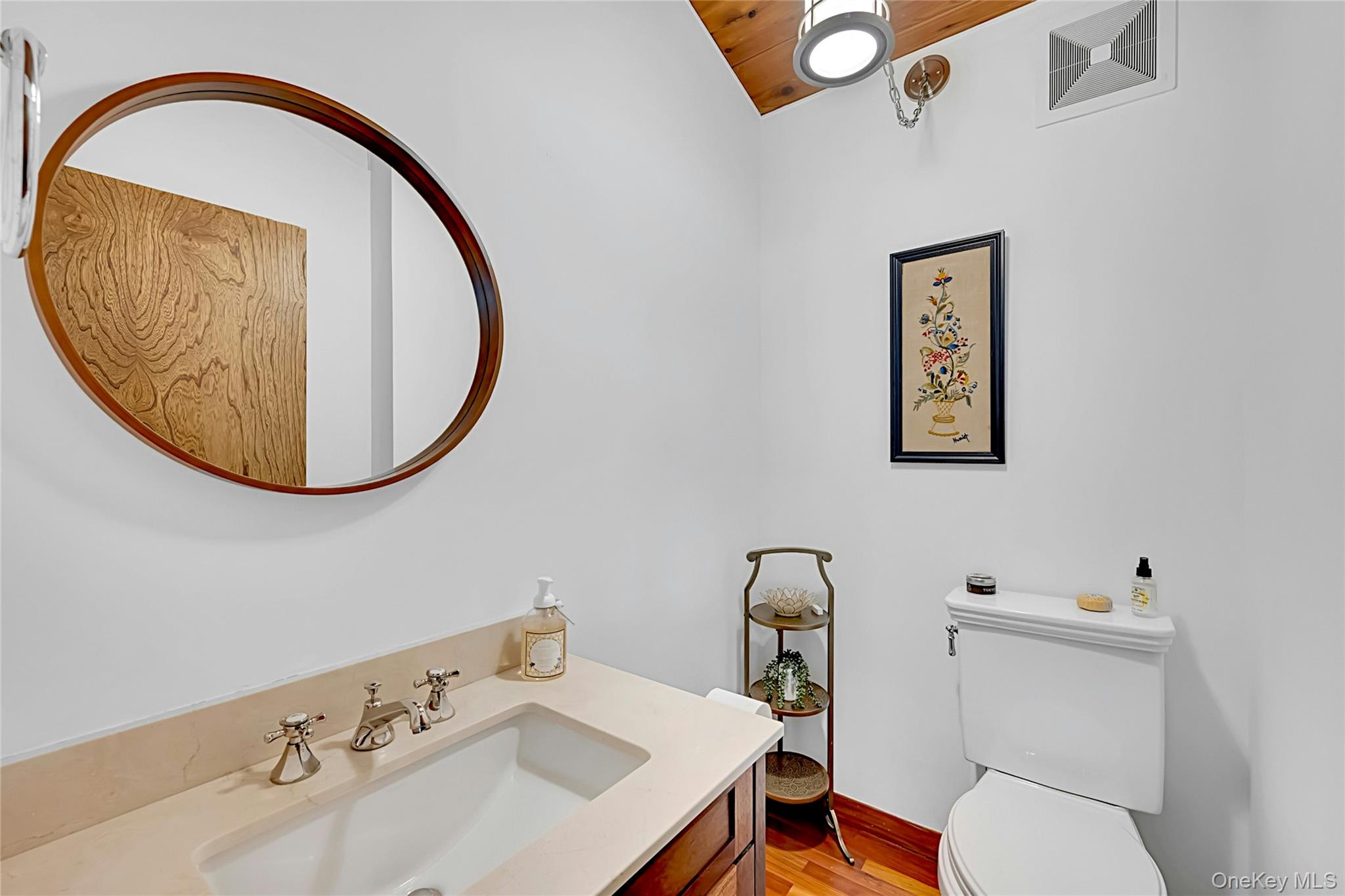 120 Kitchawan Road Pound Ridge, NY 10576 - Photo 25 of 40 a bathroom with a sink mirror and toilet