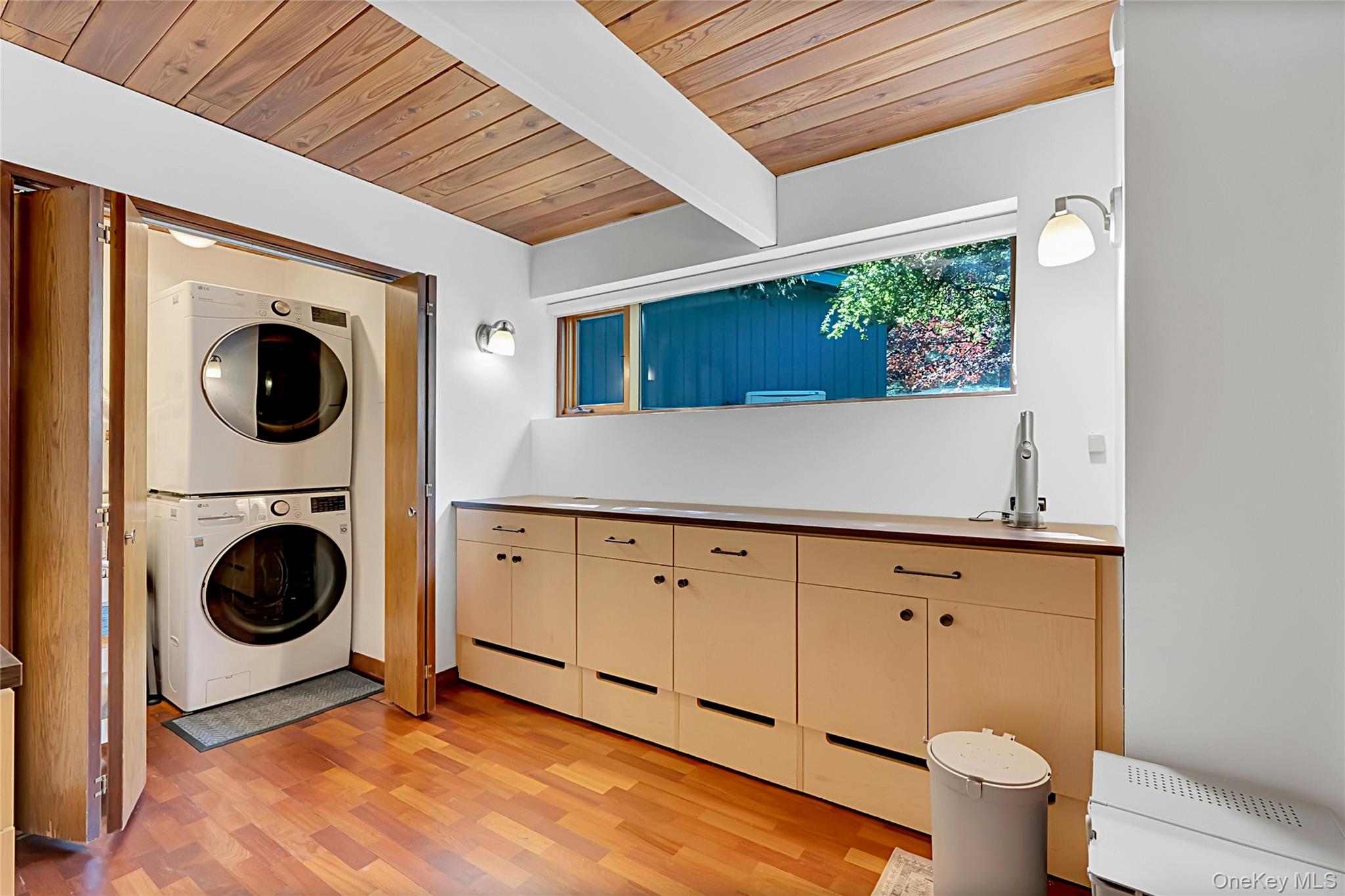 120 Kitchawan Road Pound Ridge, NY 10576 - Photo 32 of 40 a living room with dryer and washer