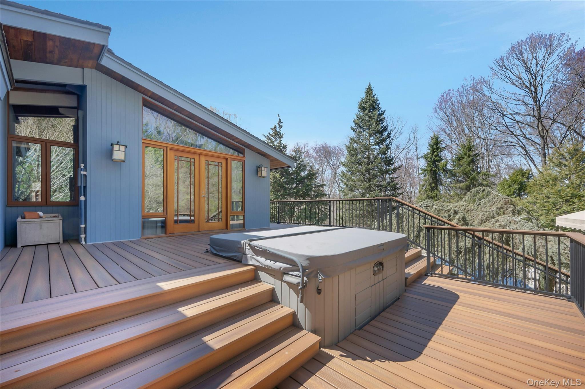 120 Kitchawan Road Pound Ridge, NY 10576 - Photo 33 of 40 a view of a wooden deck with a bench
