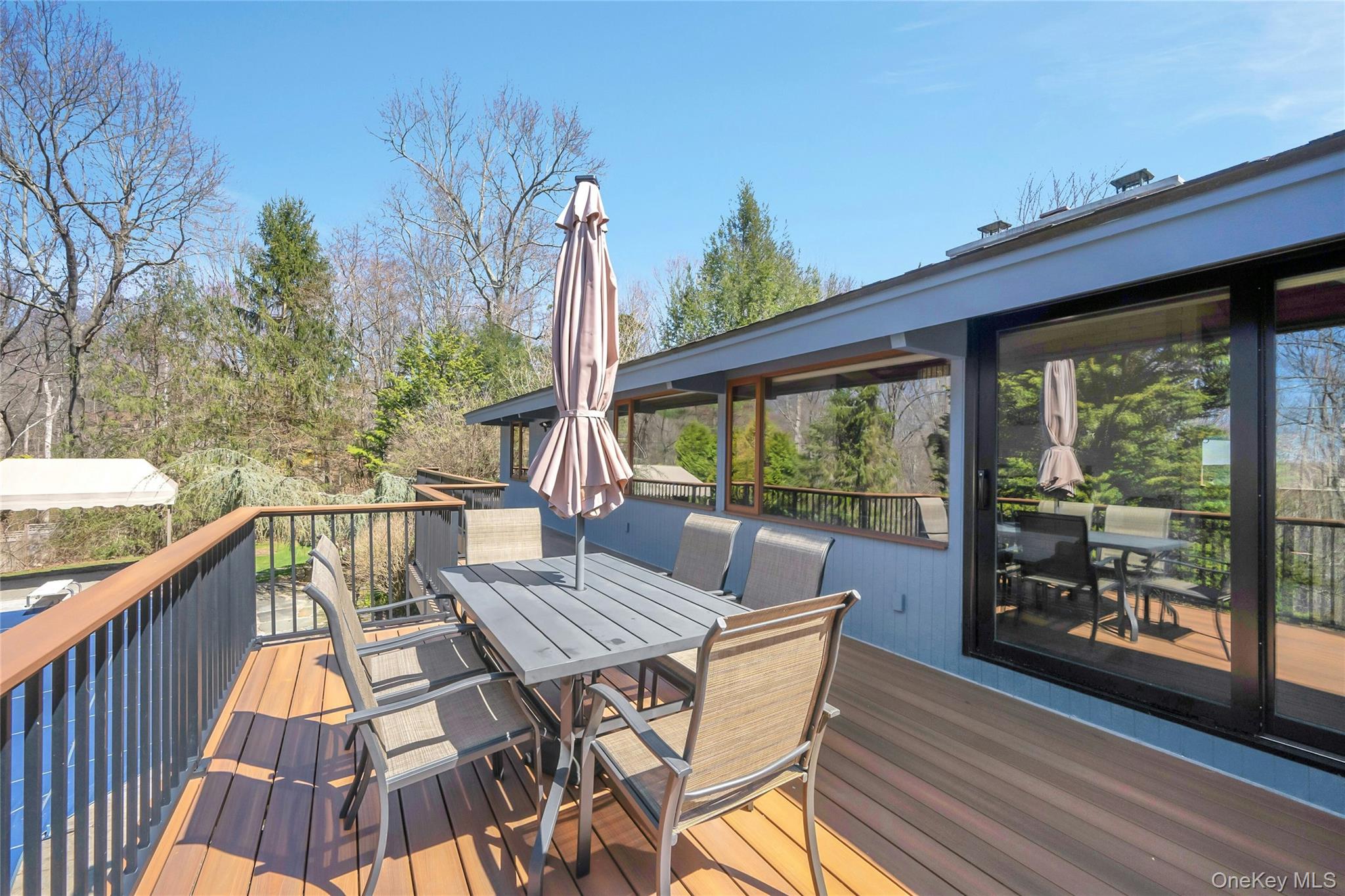120 Kitchawan Road Pound Ridge, NY 10576 - Photo 35 of 40 a view of balcony with wooden floor and outdoor seating