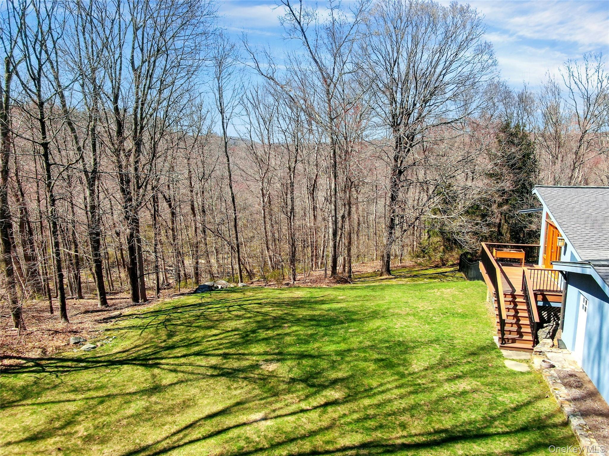 120 Kitchawan Road Pound Ridge, NY 10576 - Photo 36 of 40 a backyard of a house with lots of green space