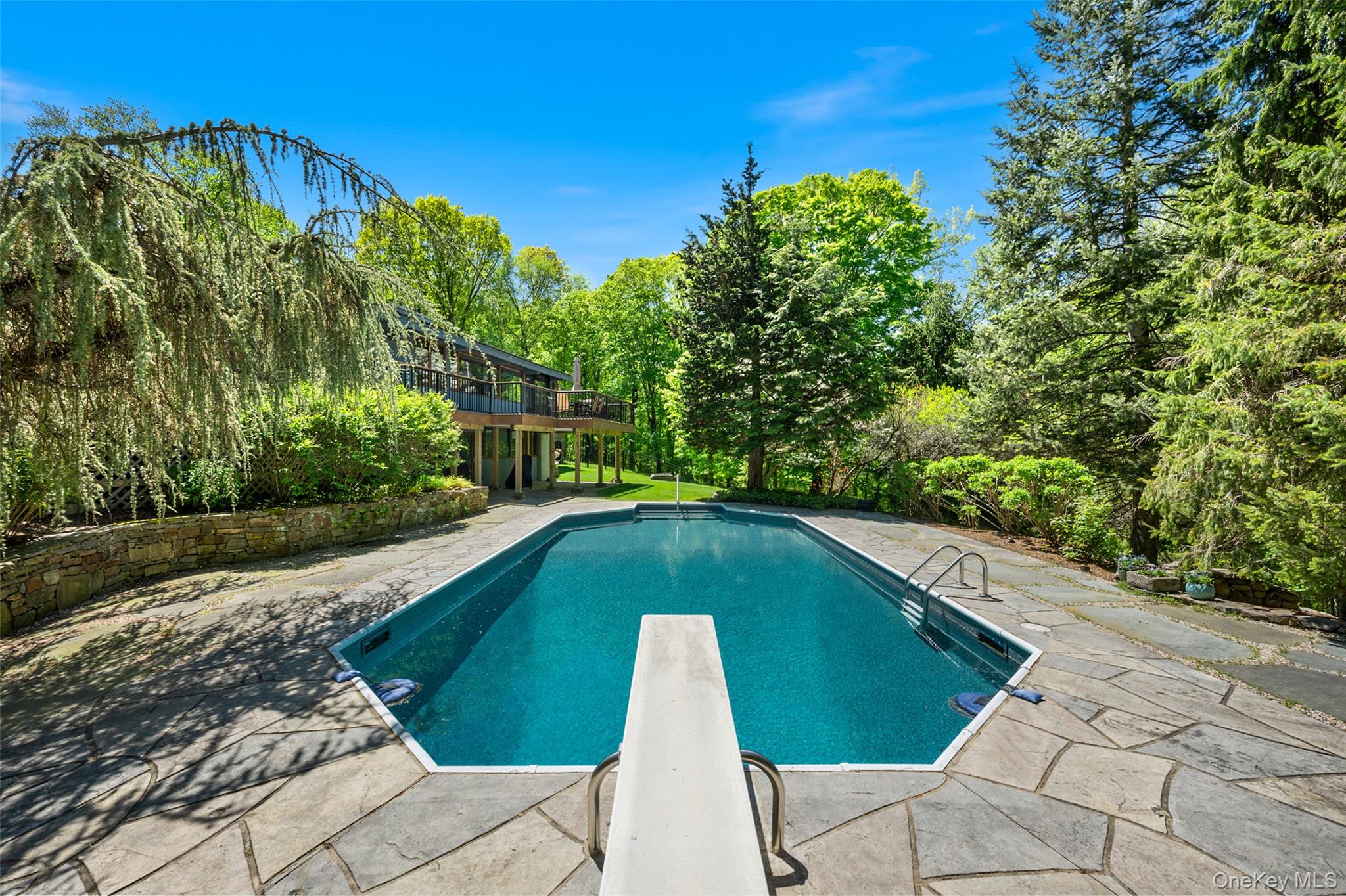 120 Kitchawan Road Pound Ridge, NY 10576 - Photo 5 of 40 a view of swimming pool with a patio