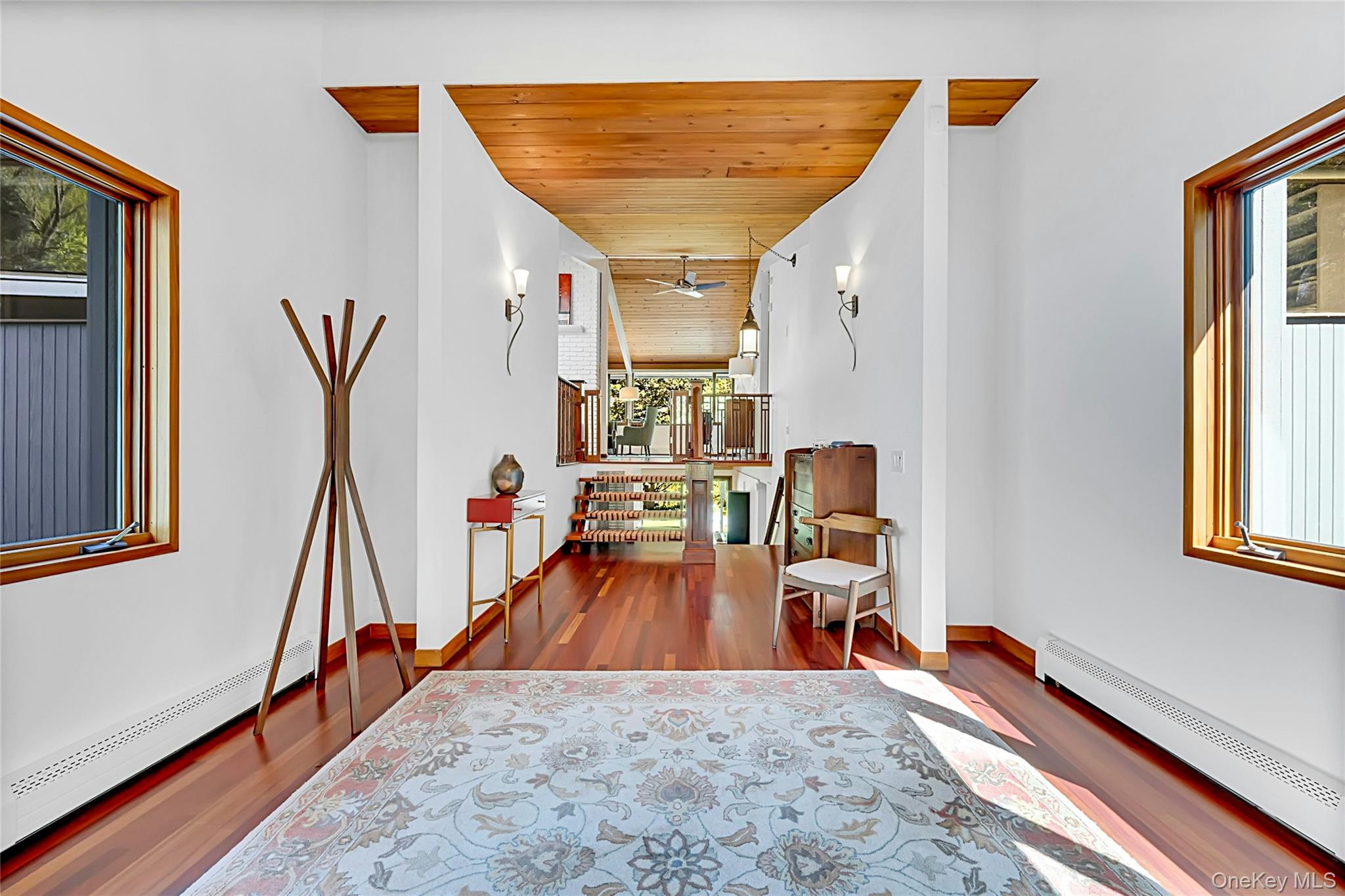 120 Kitchawan Road Pound Ridge, NY 10576 - Photo 7 of 40 a view of a entryway with wooden floor and stairs