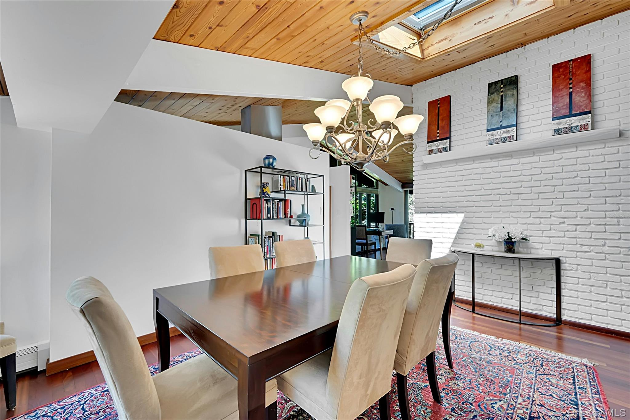 120 Kitchawan Road Pound Ridge, NY 10576 - Photo 9 of 40 a view of a dining room with furniture and chandelier