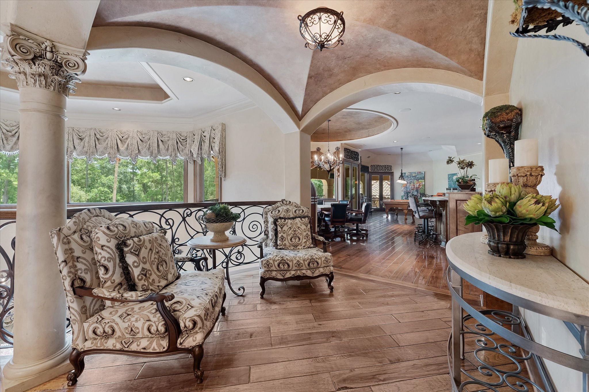 28322 Meadow Forest Magnolia, TX 77355 - Photo 24 of 50 Venetian plaster dome ceiling with custom chandeliers with Custom Tray Ceiling With Cove Lighting, Recessed Speakers, and Recessed Lighting.
