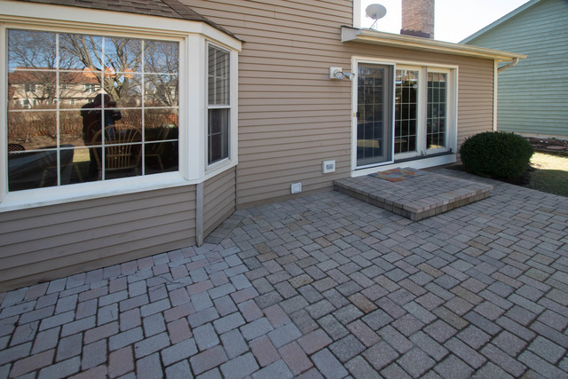 1795 Denison Road Naperville, IL 60565 - Photo 22 of 25 a front view of a house with a large window