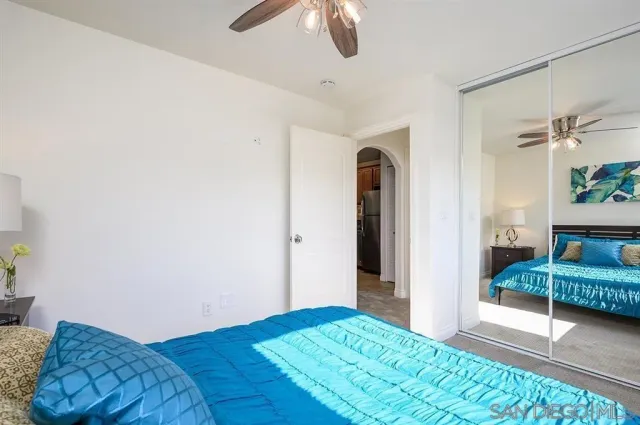 a bedroom with a bed and a view of bathroom