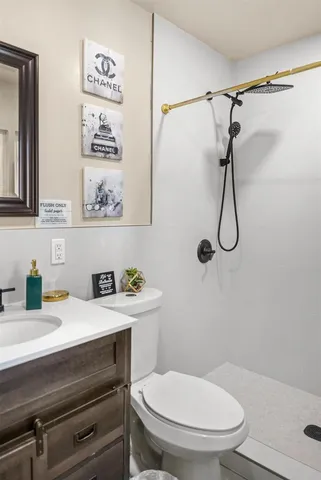 a bathroom with a toilet and a sink