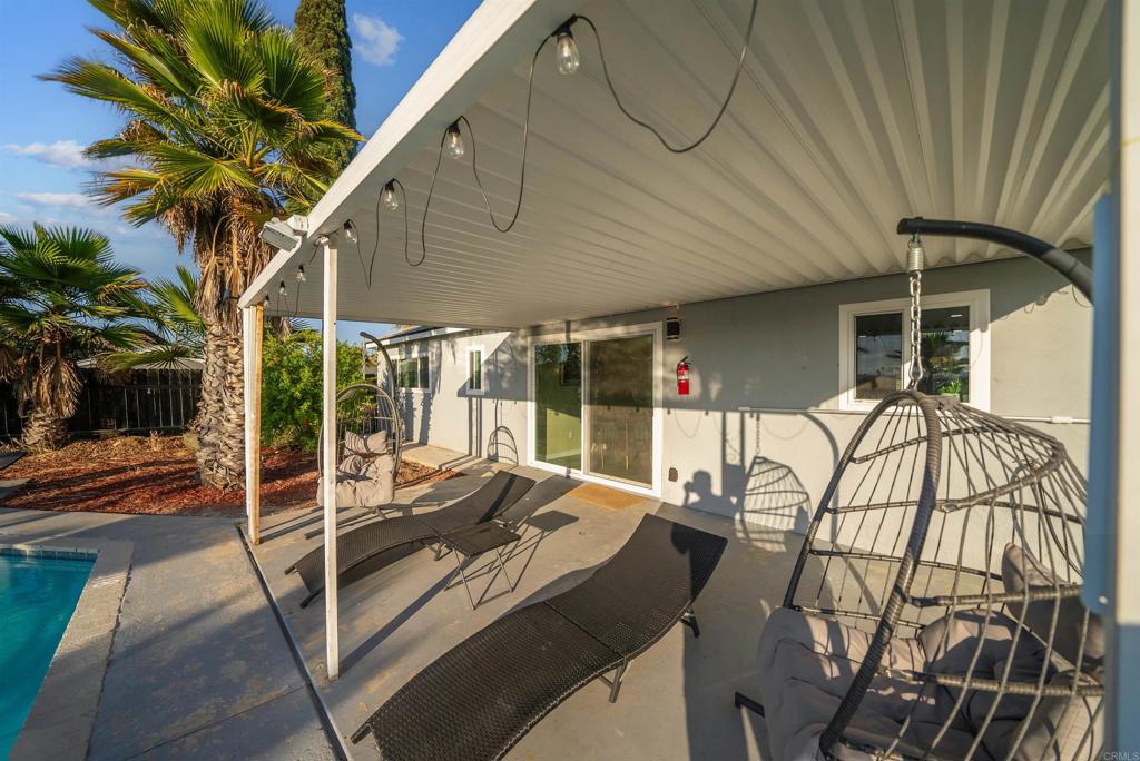 8543 Via Consuelo El Cajon, CA 92021 - Photo 23 of 51 a view of a patio with table and chairs and potted plants