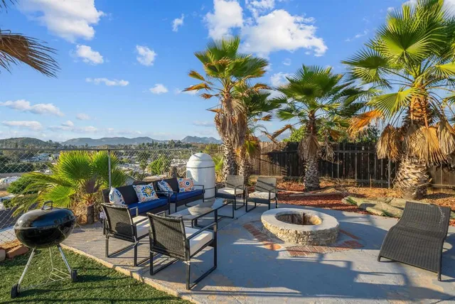 a swimming pool with outdoor seating