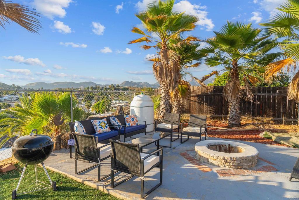 8543 Via Consuelo El Cajon, CA 92021 - Photo 30 of 51 a backyard of a house with table and chairs
