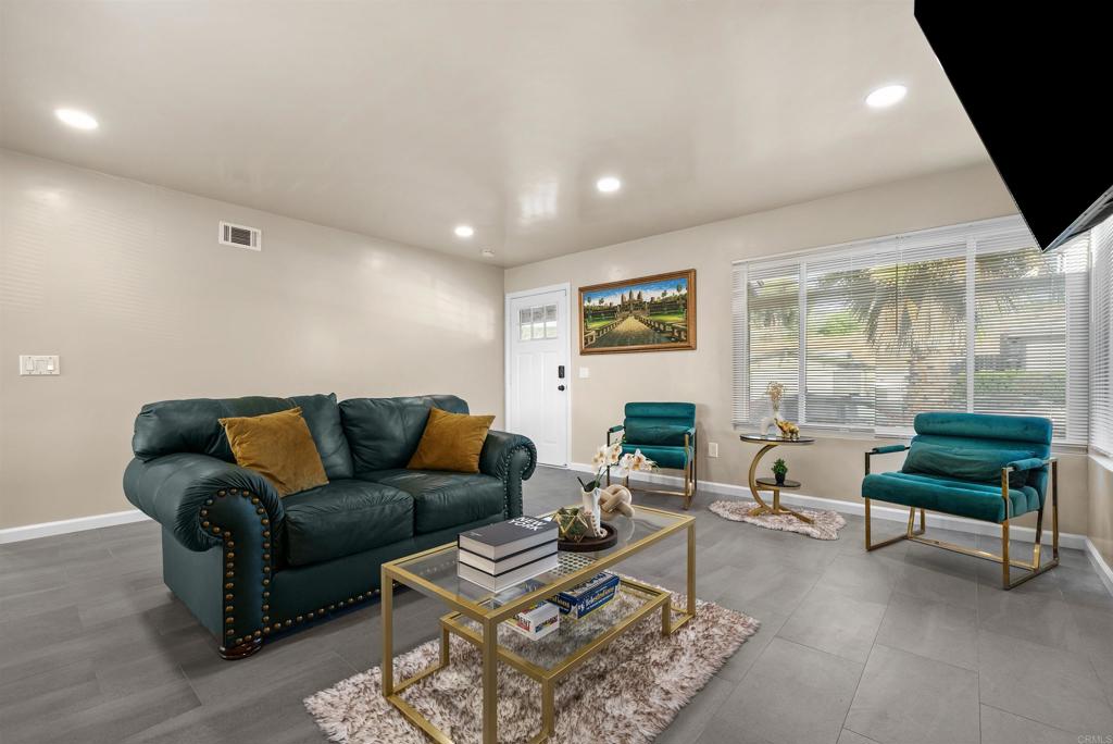 8543 Via Consuelo El Cajon, CA 92021 - Photo 3 of 51 a living room with furniture and a large window