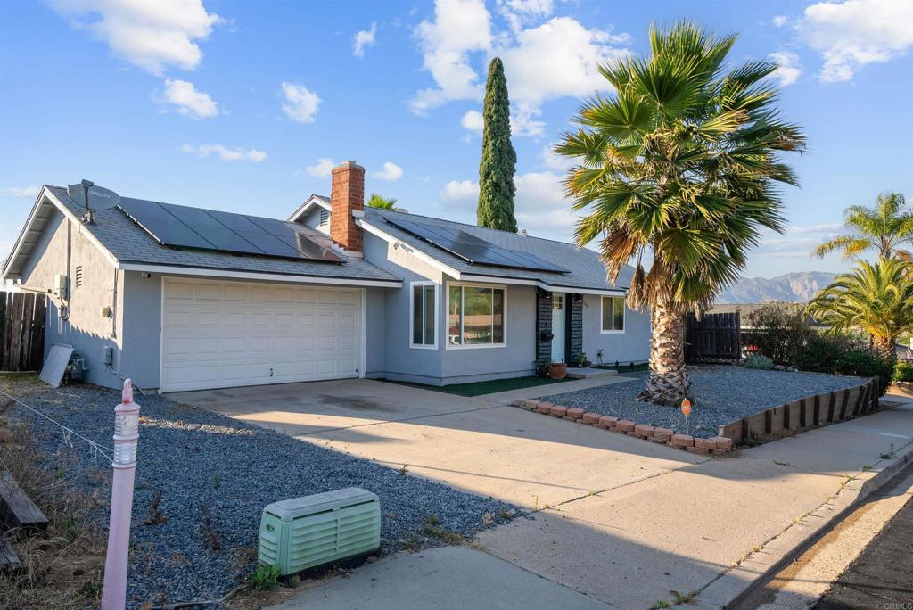 8543 Via Consuelo El Cajon, CA 92021 - Photo 41 of 51 a front view of a house with garden