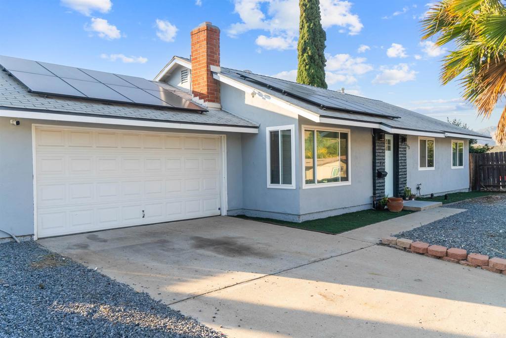 8543 Via Consuelo El Cajon, CA 92021 - Photo 42 of 51 a front view of a house with garage