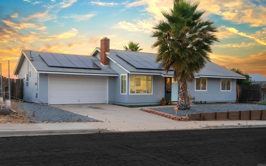 8543 Via Consuelo El Cajon, CA 92021 - Photo 44 of 51 a front view of a house with a yard