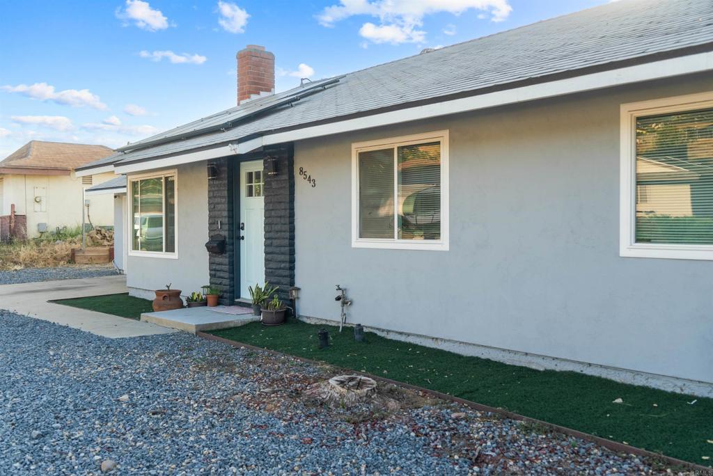 8543 Via Consuelo El Cajon, CA 92021 - Photo 45 of 51 a view of a house with backyard and porch