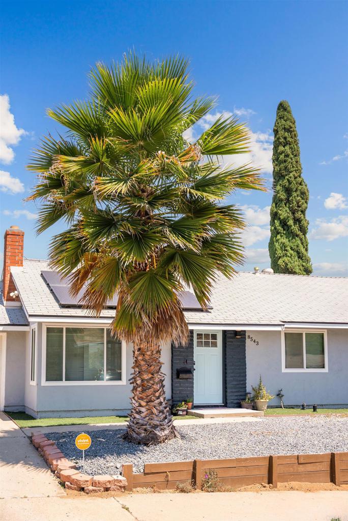 8543 Via Consuelo El Cajon, CA 92021 - Photo 50 of 51 a front view of a house with a yard