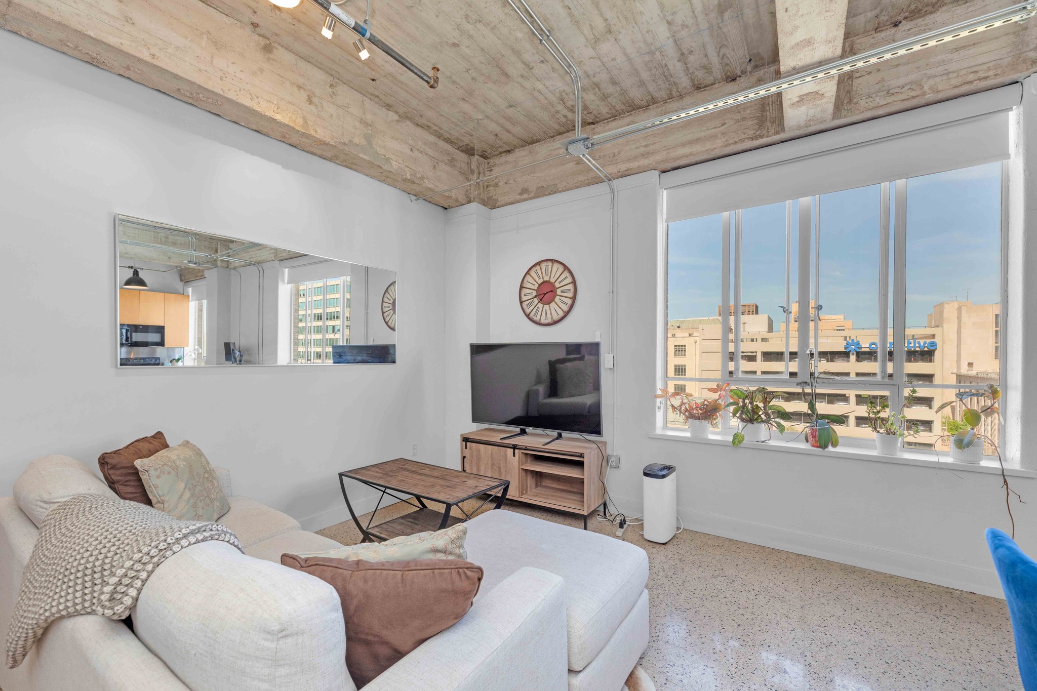 710 Colorado Street, Unit 8C Austin, TX 78701 - Photo 12 of 30 Living area with large windows and downtown views