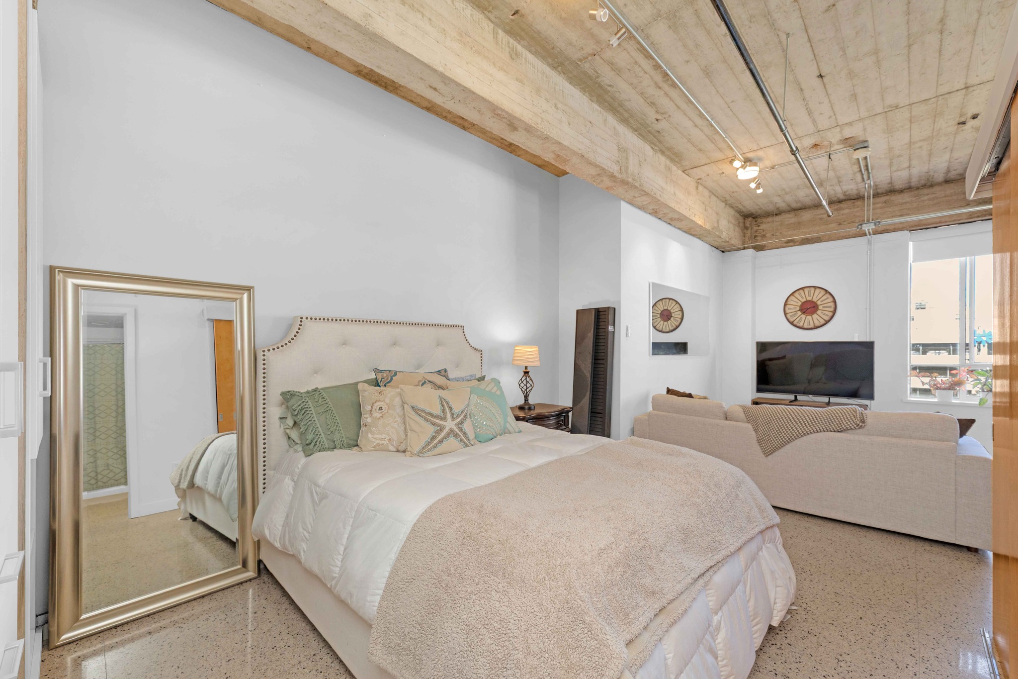 710 Colorado Street, Unit 8C Austin, TX 78701 - Photo 14 of 30 Bedroom area with open layout and high ceilings