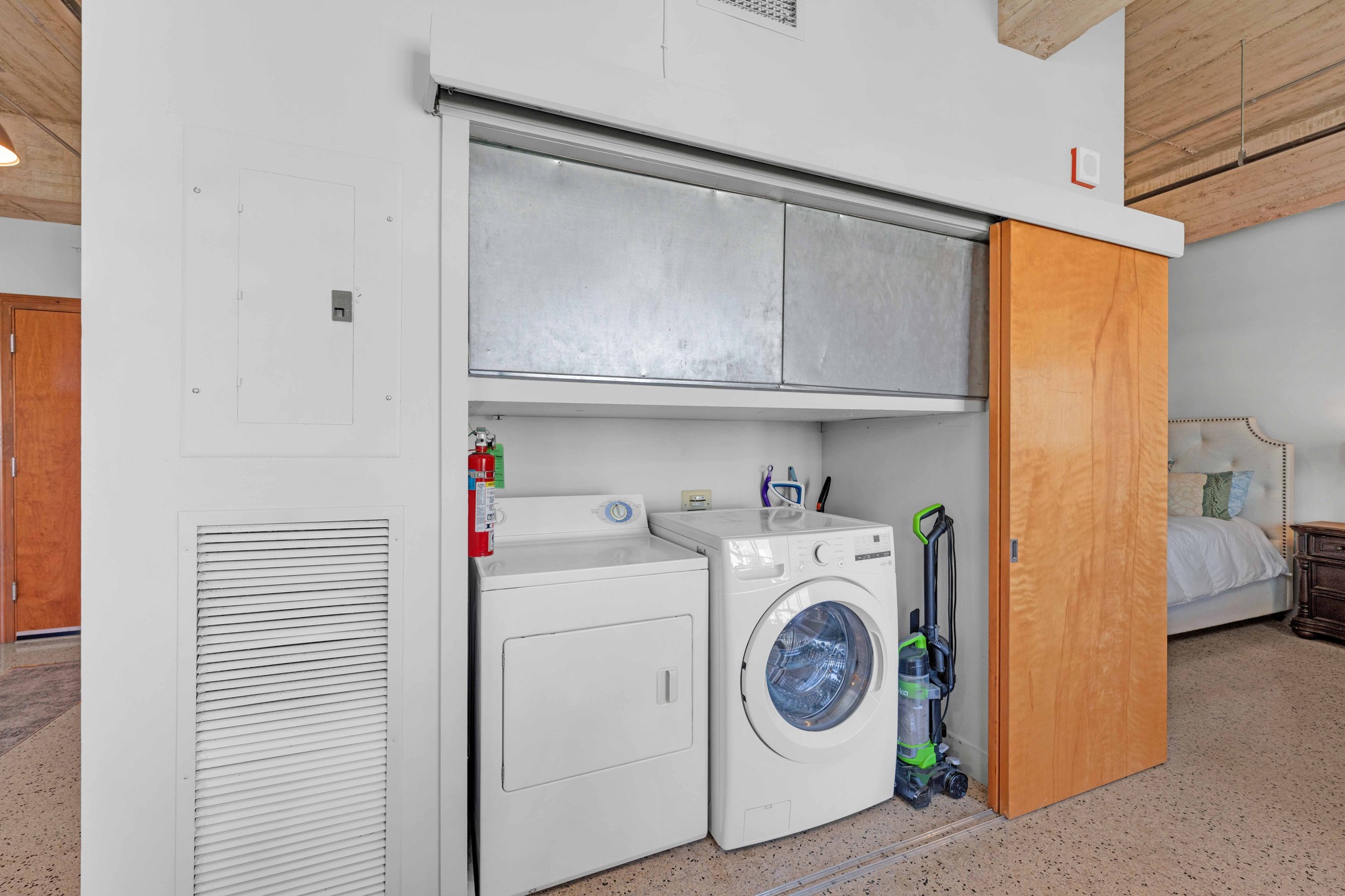 710 Colorado Street, Unit 8C Austin, TX 78701 - Photo 17 of 30 In-unit washer and dryer with additional storage space