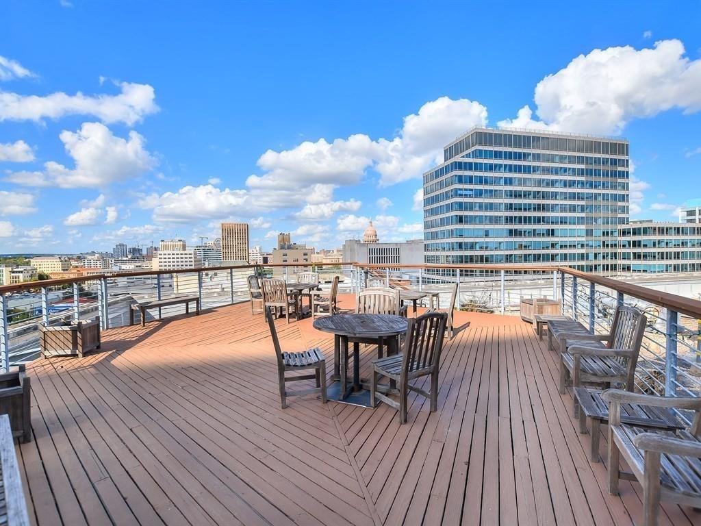 710 Colorado Street, Unit 8C Austin, TX 78701 - Photo 3 of 30 Deck with a city view and outdoor dining space