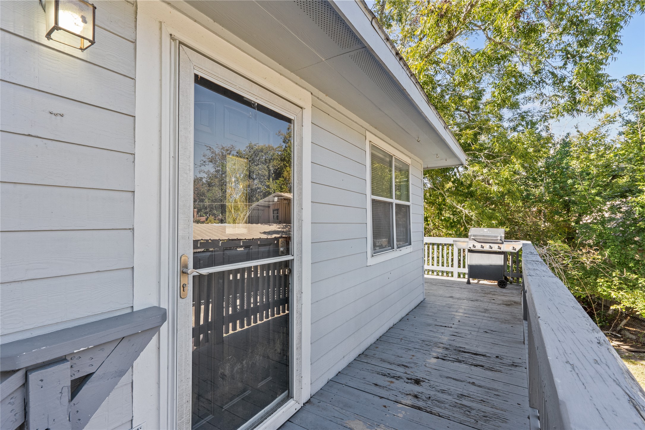 336 Reppert Street, Unit A Bacliff, TX 77518 - Photo 2 of 17 a view of a balcony with floor to ceiling window and wooden floor