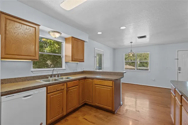 a kitchen with a sink and cabinets