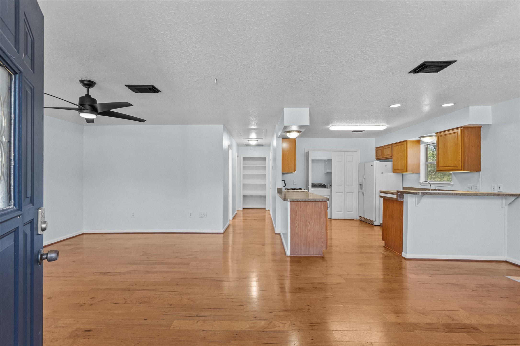 336 Reppert Street, Unit A Bacliff, TX 77518 - Photo 9 of 17 a view of a living room and kitchen with furniture appliances