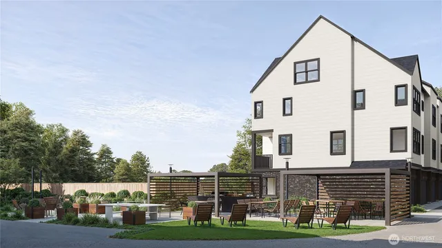 a view of an white house with a yard