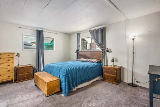 a bedroom with a bed and a cabinets