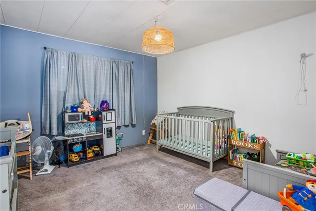 a room with toys and a view of living room