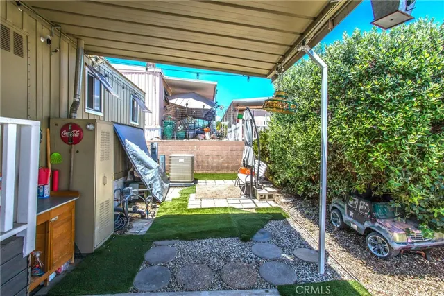 a view of a backyard with wooden fence