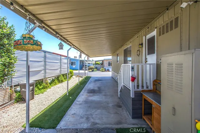 a balcony with table and chairs