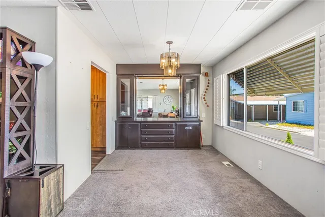a kitchen with wooden cabinets and sink