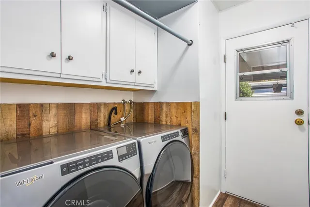 a bedroom with a bed and a cabinets