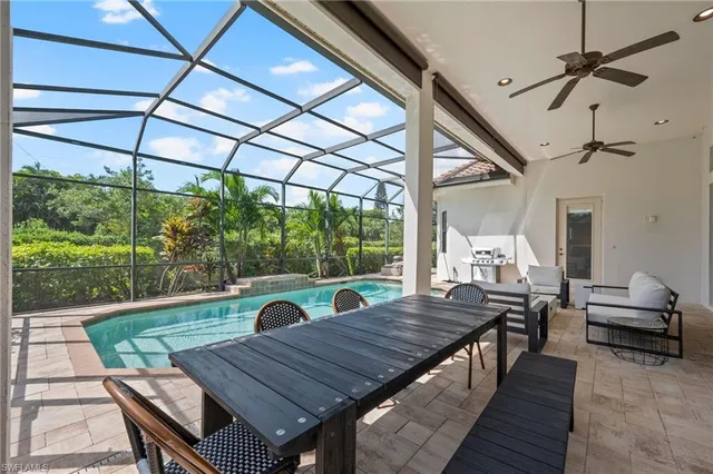 a view of a patio with table and chairs
