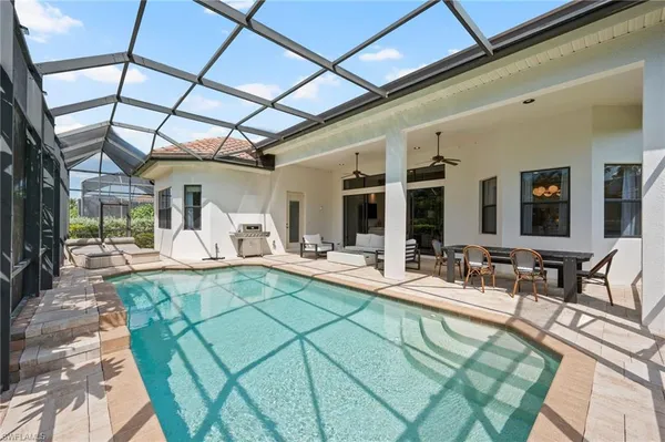 a view of a swimming pool with a patio