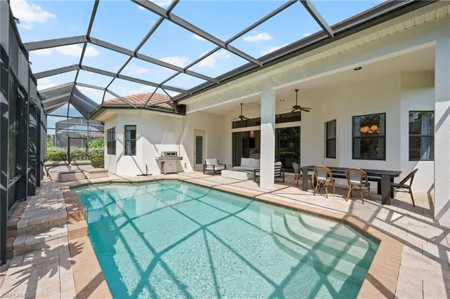 a view of a swimming pool with a patio