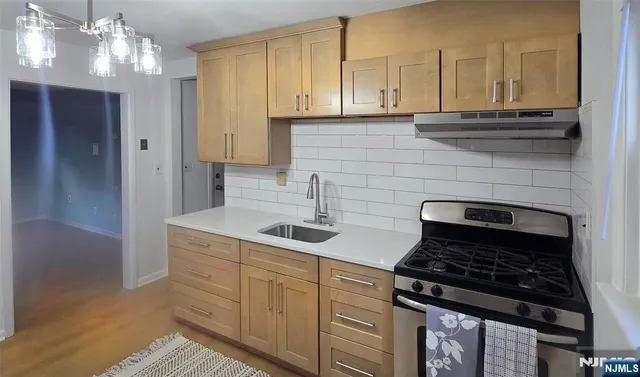 a kitchen with cabinets and appliances