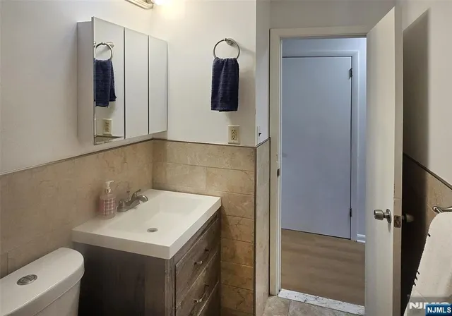 a bathroom with a sink and mirror