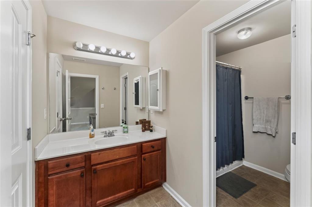 113 Tyson Woods Road Acworth, GA 30102 - Photo 33 of 37 a bathroom with a sink and a mirror