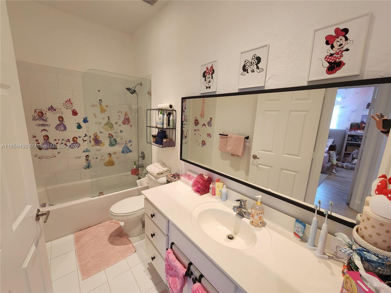 Ives Estates Miami, FL 33179 - Photo 15 of 28 a bathroom with a sink mirror toilet and bathtub
