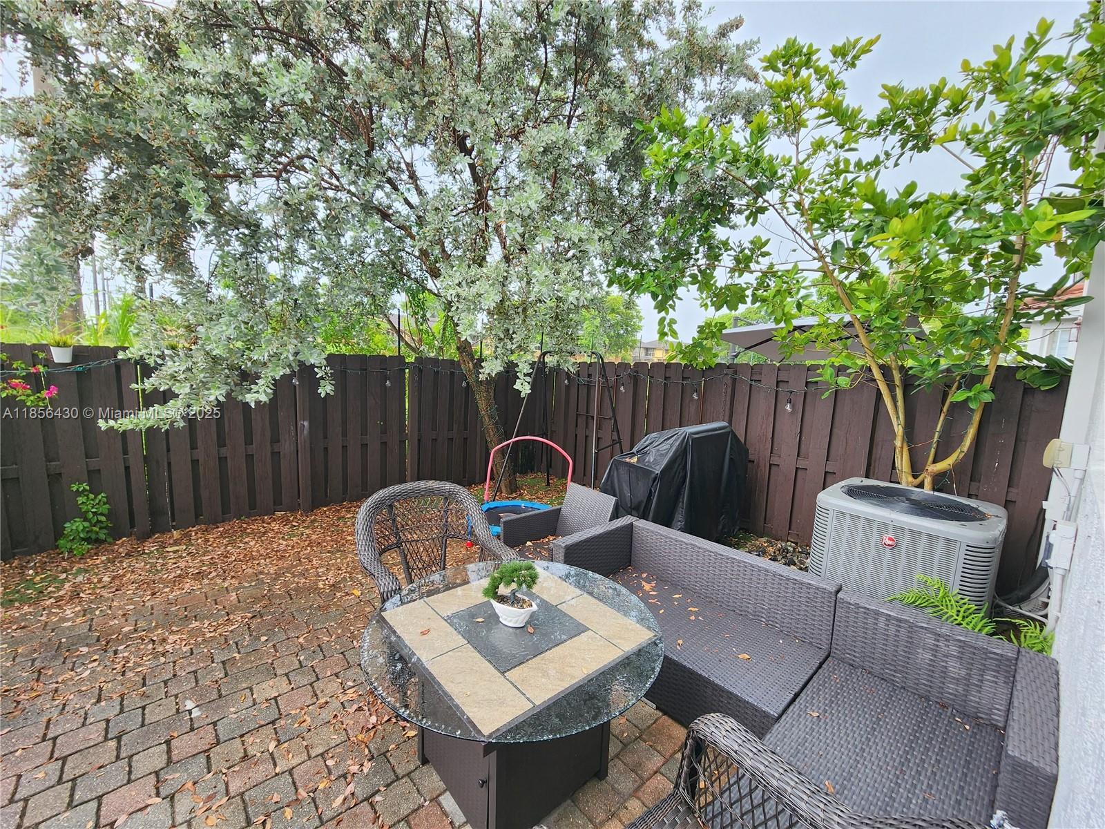 Ives Estates Miami, FL 33179 - Photo 19 of 28 a backyard of a house with barbeque oven