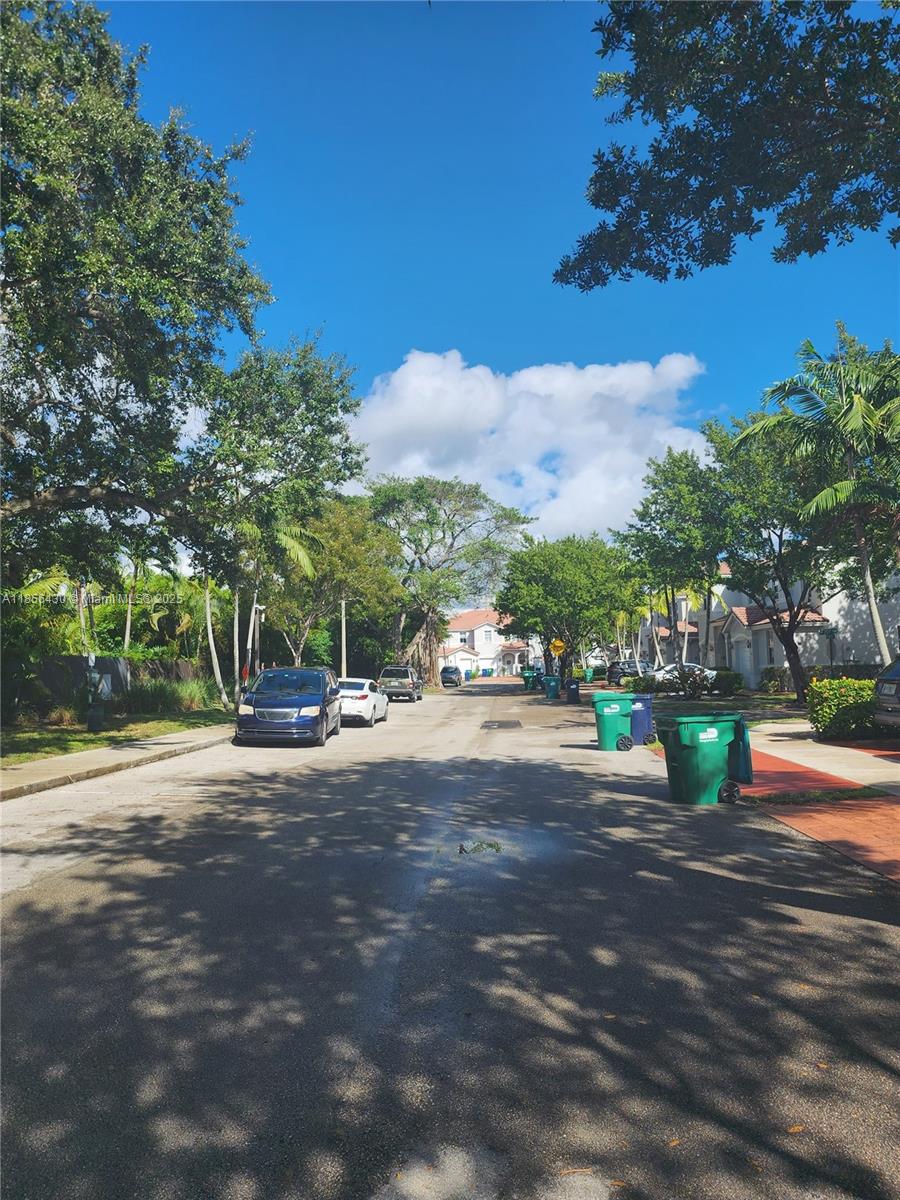 Ives Estates Miami, FL 33179 - Photo 27 of 28 a view of a street with houses