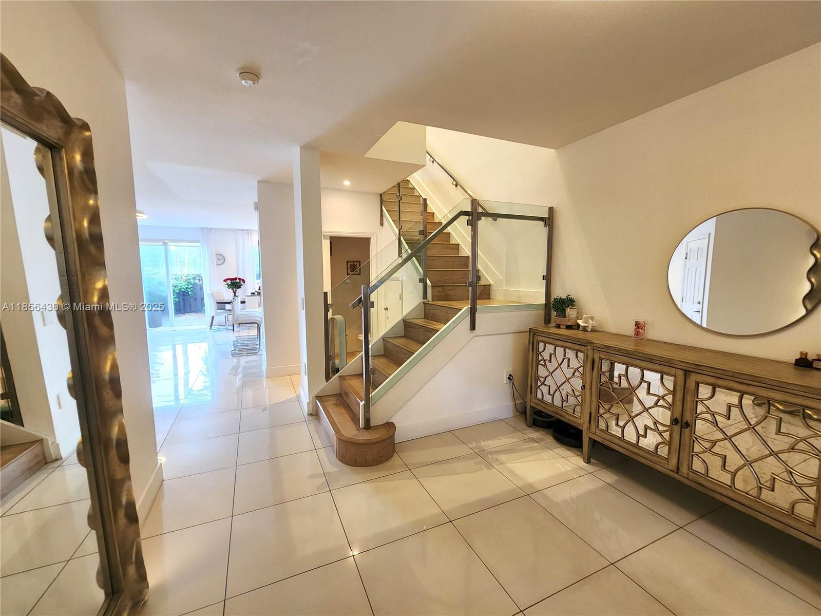 Ives Estates Miami, FL 33179 - Photo 4 of 28 a view of an entryway with wooden floor