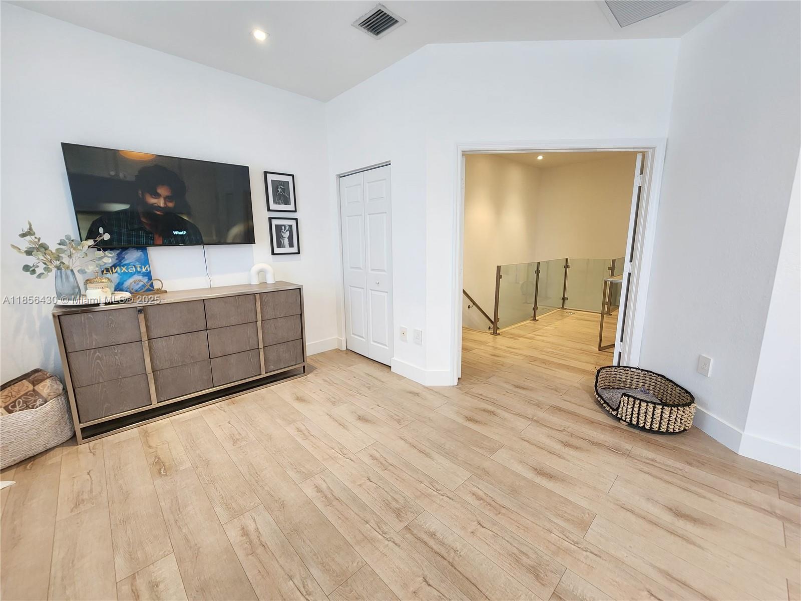 Ives Estates Miami, FL 33179 - Photo 9 of 28 a living room with furniture and a flat screen tv