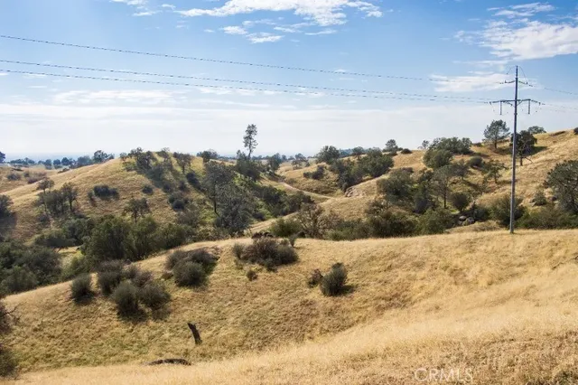 a view of a yard with a snow in the background