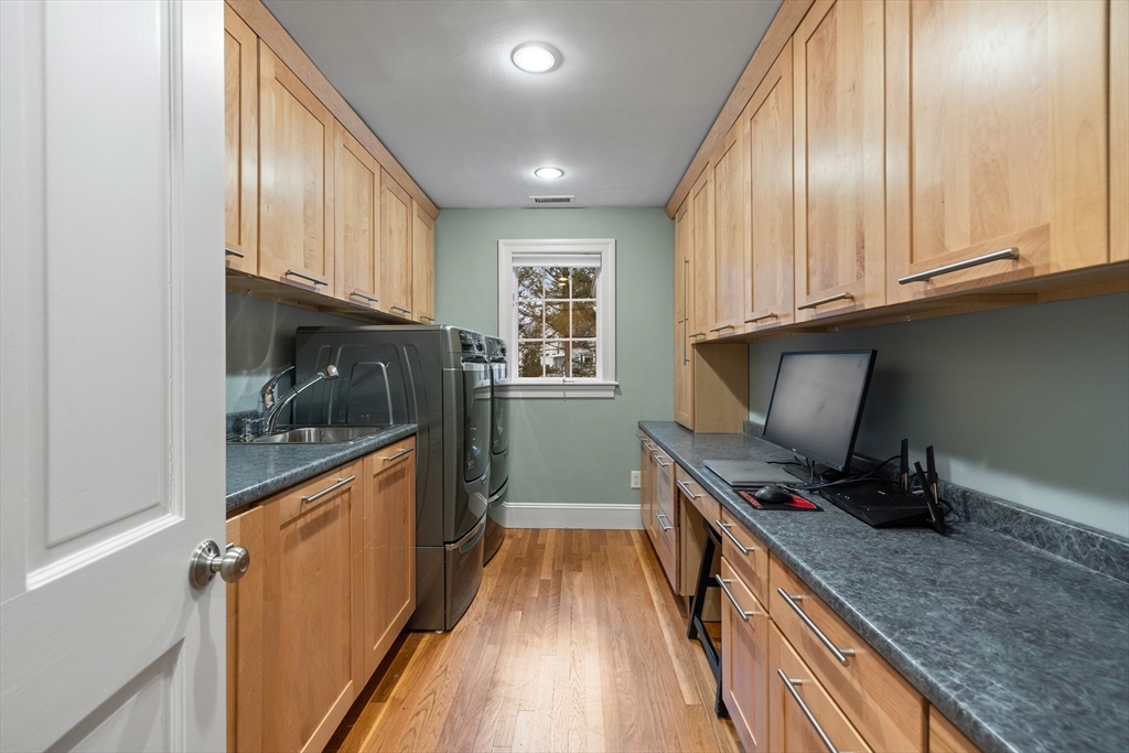9 Augustus Road Lexington, MA 02421 - Photo 21 of 41 a kitchen with granite countertop a stove a sink and a refrigerator